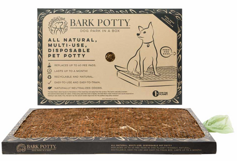 A Bark Potty natural bark pad shown as pee pads for dogs, laid flat below its kraft-paper packaging.