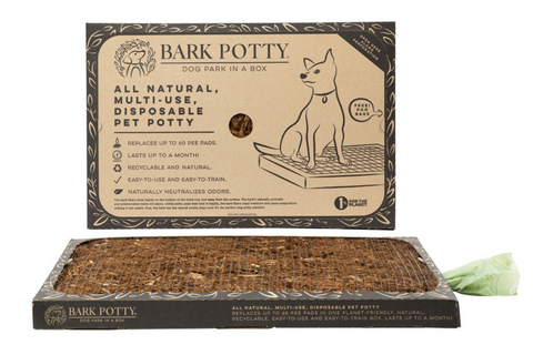 The Bark Potty bark potty pad displayed in front of its kraft-paper packaging on a white background.