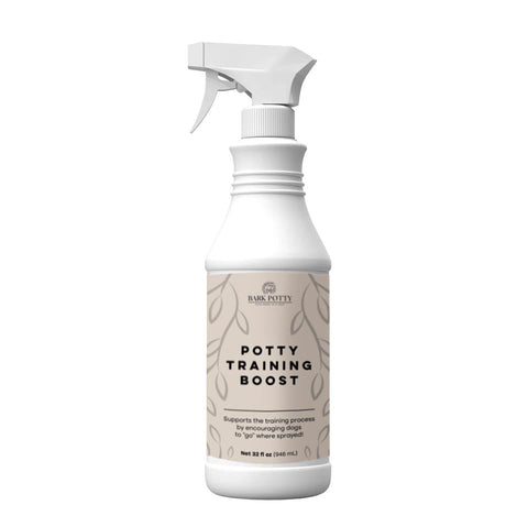 A Bark Potty Potty Training Boost spray bottle used for potty pad training.