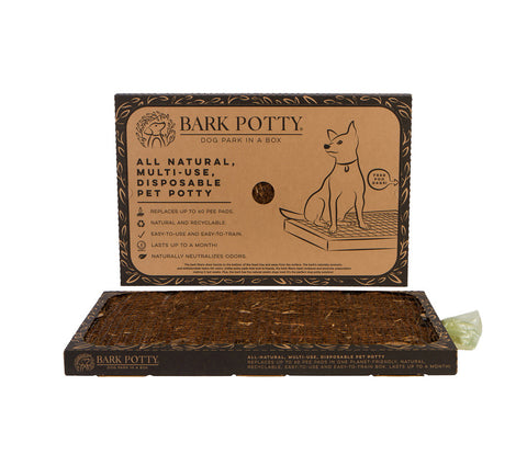 A standard-size Bark Potty pad displayed with its kraft-paper packaging as an indoor dog bathroom option.
