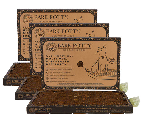 Three Bark Potty pads stacked with their packaging, offered as a subscription bundle of puppy pads.